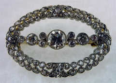 Antique Oval Shaped Diamond Brooch in Platinum and 18K Yellow Gold