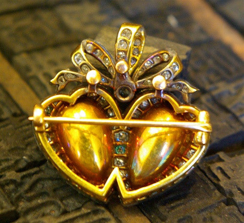 Heart Shaped Twin Emerald Brooch with Diamonds in 18K Gold and Platinum Circa 1910